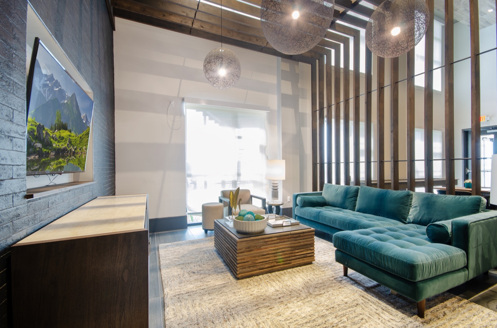 Community lounge with sofas and chairs and TV