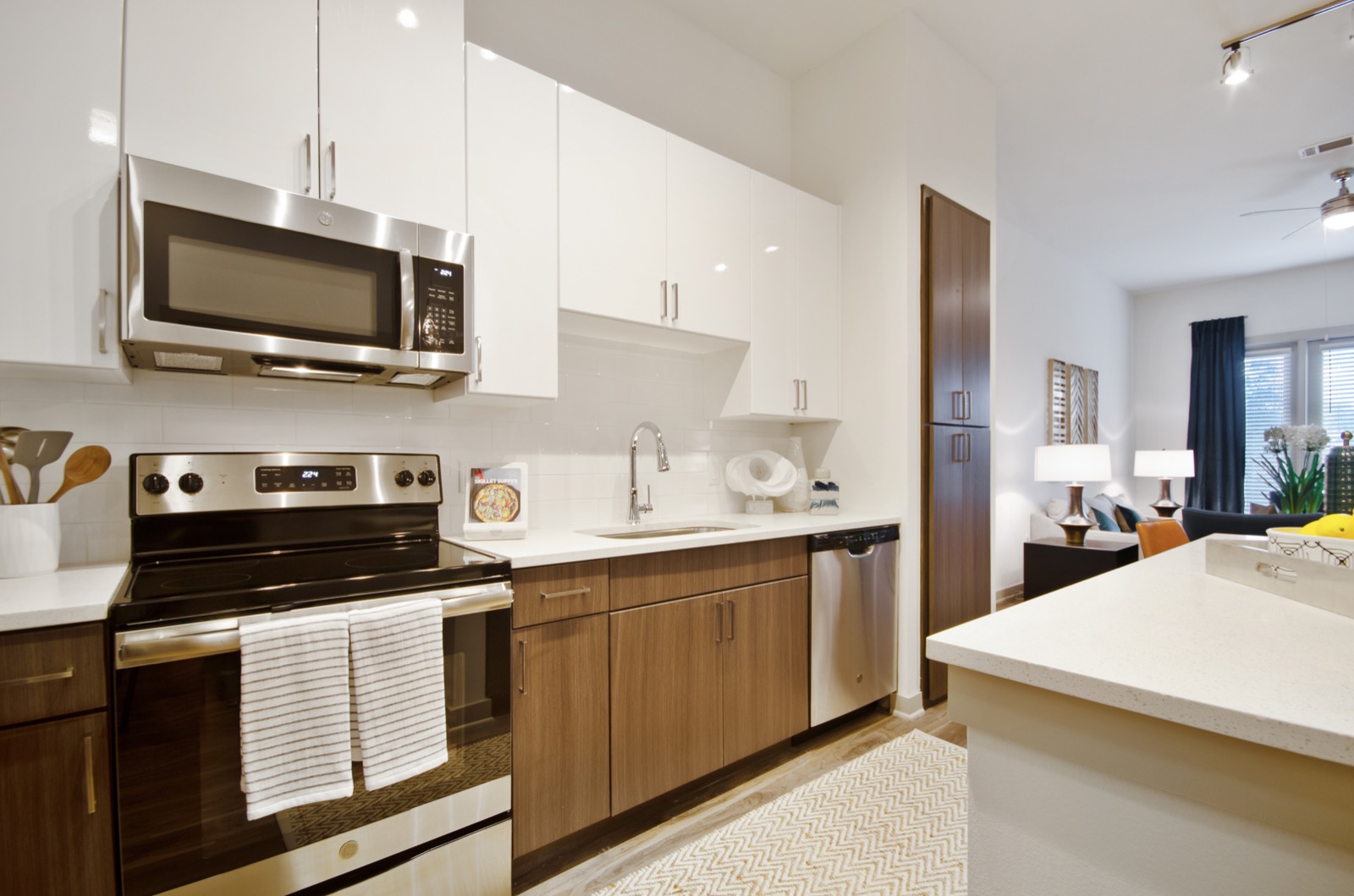 Garland TX Apartments - Domain at the One Forty Modern Kitchen With GE Energy Star Stainless Steel Appliances