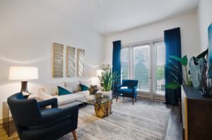 Apartments for Rent in Garland TX - Domain at the One Forty Stylish Living Room With Wood Plank Style Flooring