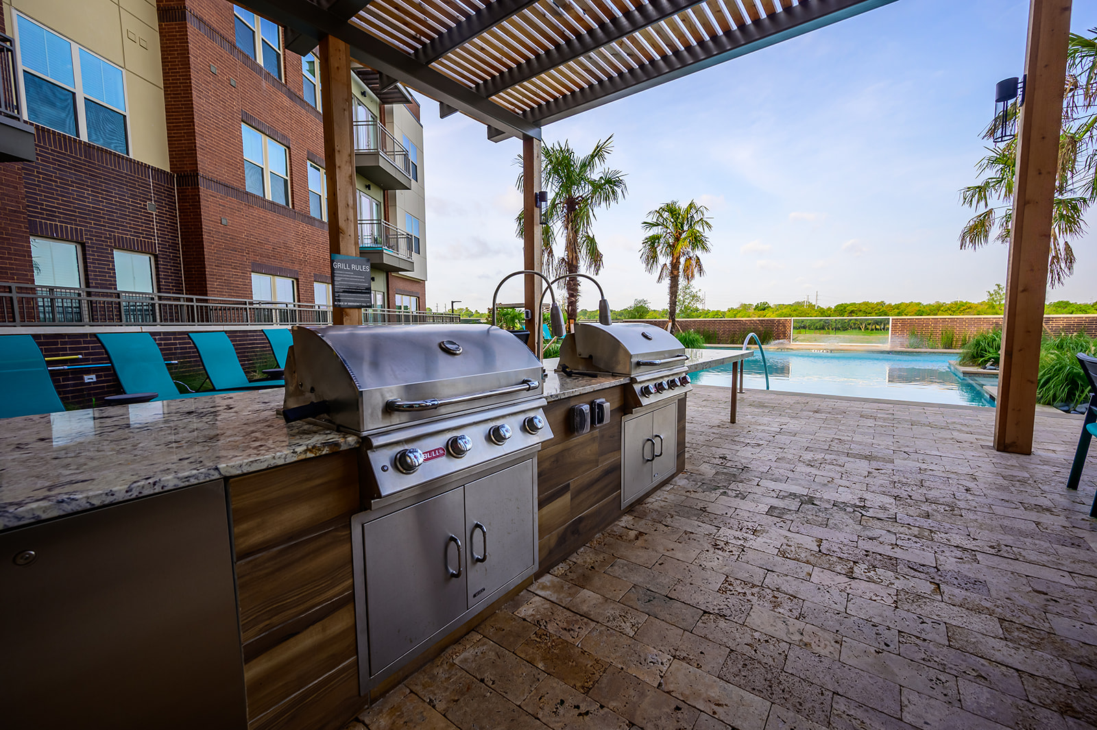 Apartments in Garland-Gorgeous Modern Outdoor Kitchen Complte With Granite Countertops and Two Stainless Steel Grills